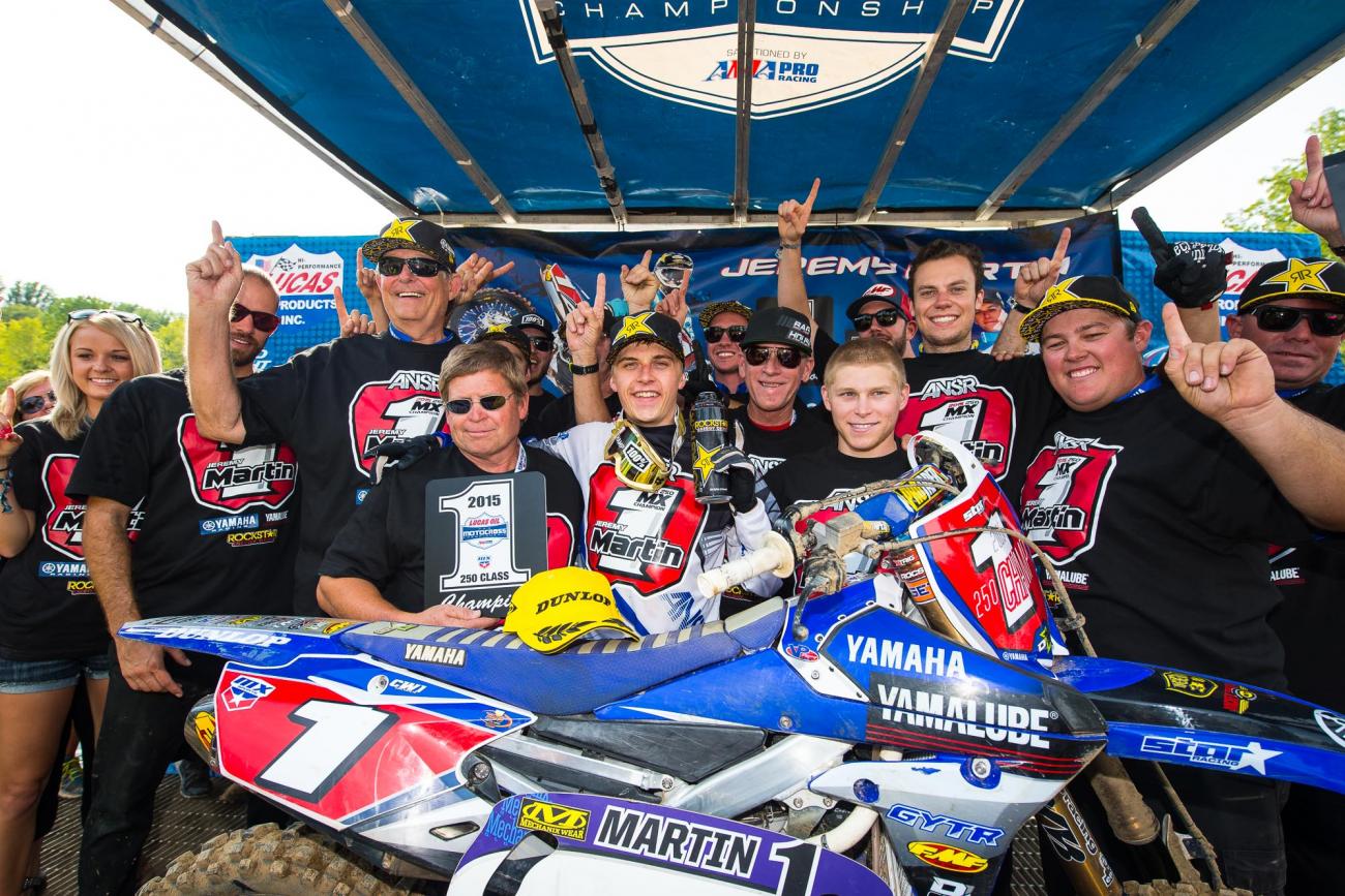 Martin celebrates victory with his team Martin celebrates victory with his team
